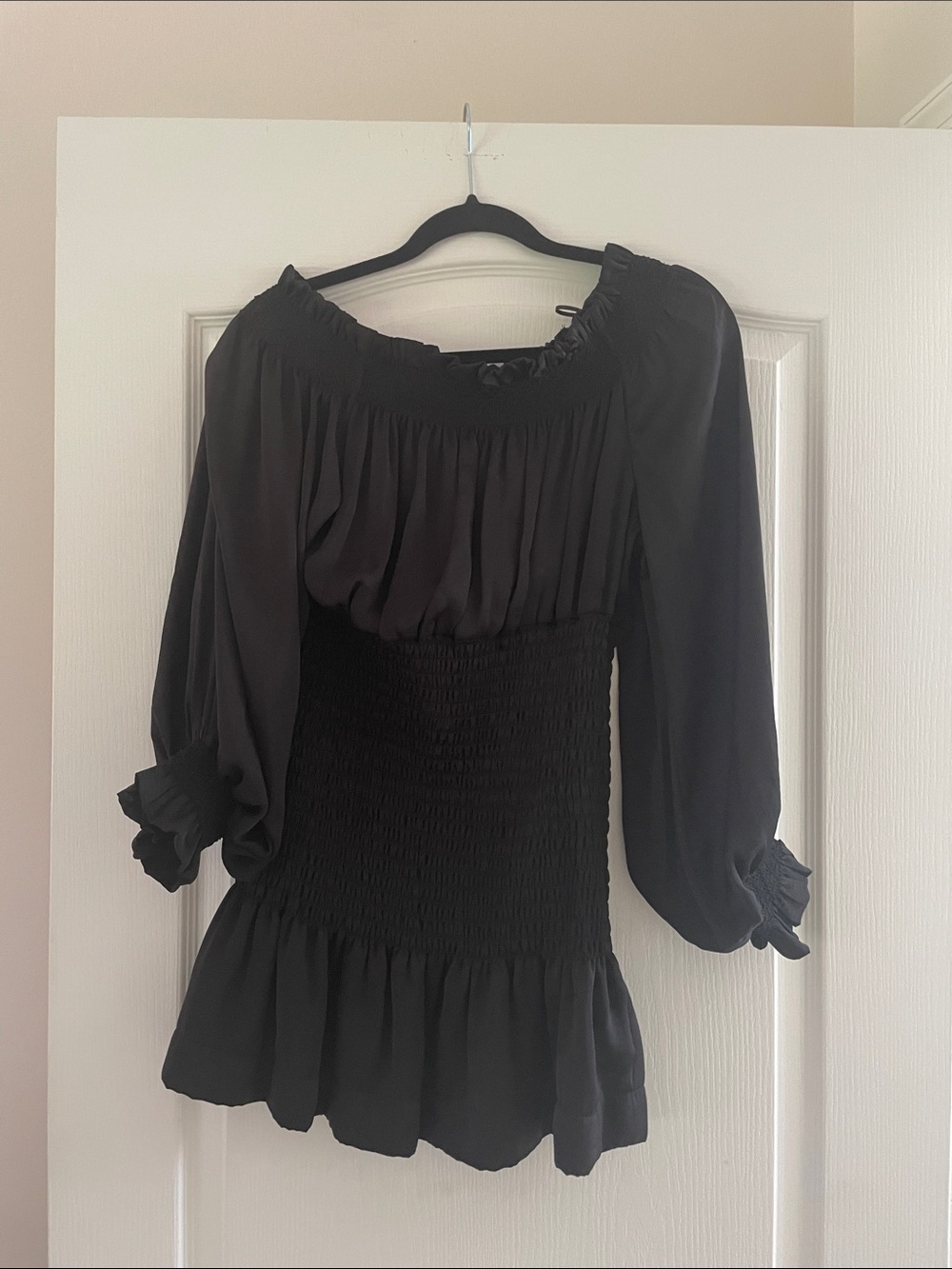 Black Off-the-Shoulder Smocked Peplum Tunic